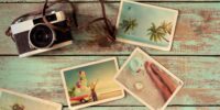 Summer photo album of journey honeymoon trip on wood table. instant photo of vintage camera - vintage and retro style